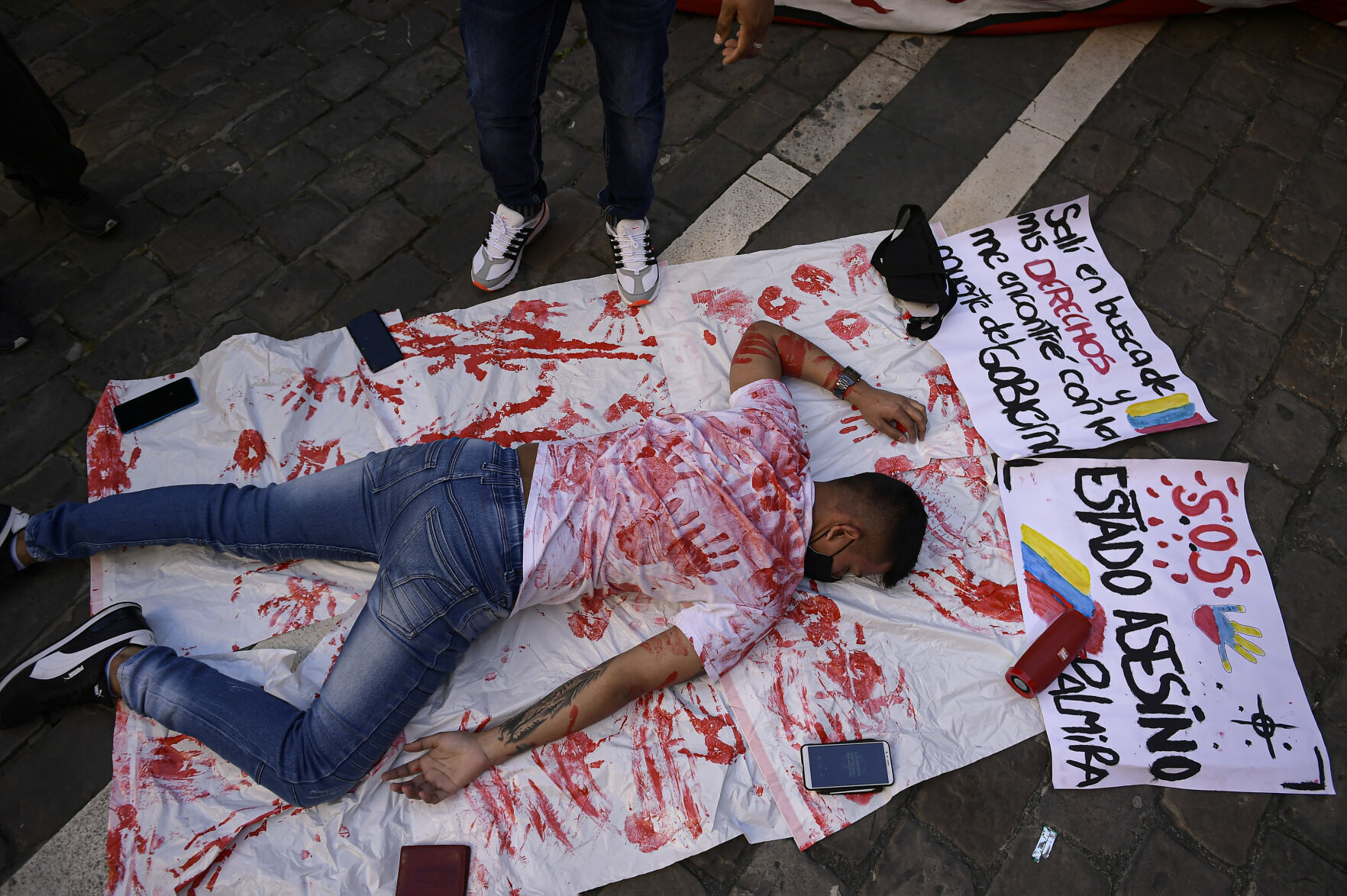 APTOPIX Virus Outbreak Spain Colombia Protest